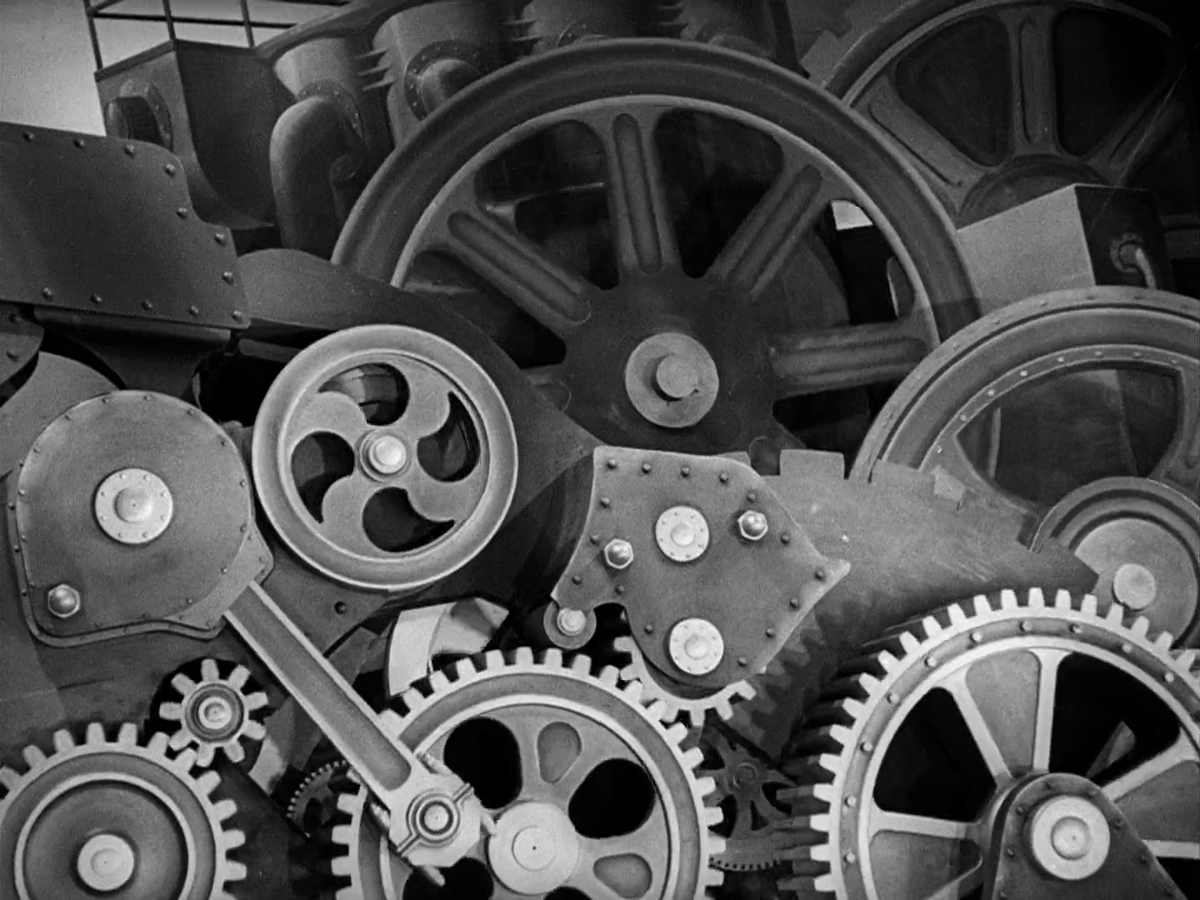 A wall of oversized, interlocking gears and machinery, from Modern Times.